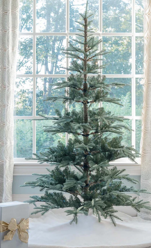 7' King Noble Fir Artificial Christmas Tree in front of window